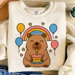 Capibara Kawaii con Arcoíris Pastel y Globos - Vector Gratis de Sublimación
